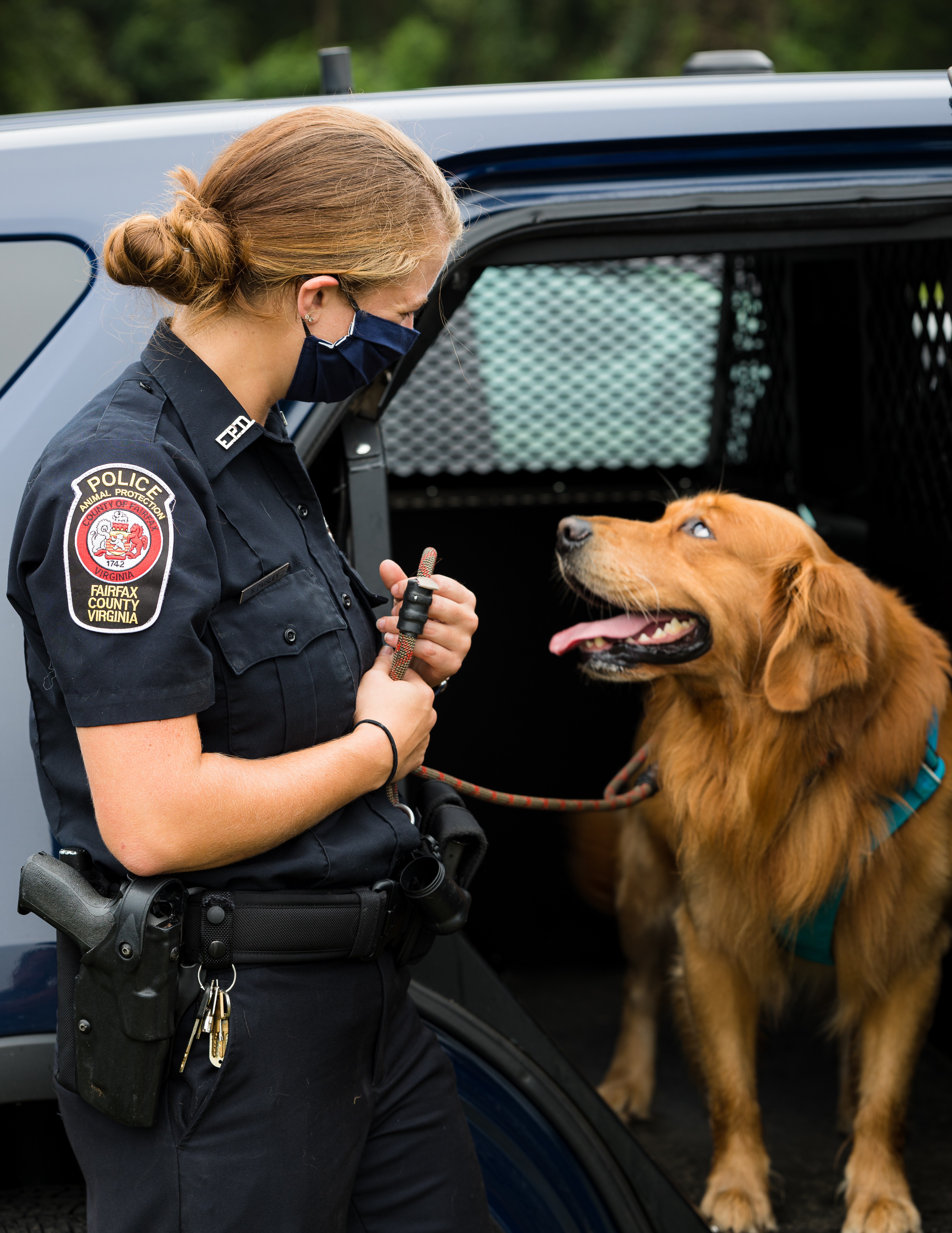 female animal protection officer poses with dog
