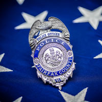 FCPD badge against blue portio nof US flag