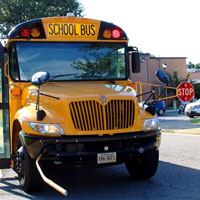 school bus with STOP sign activated