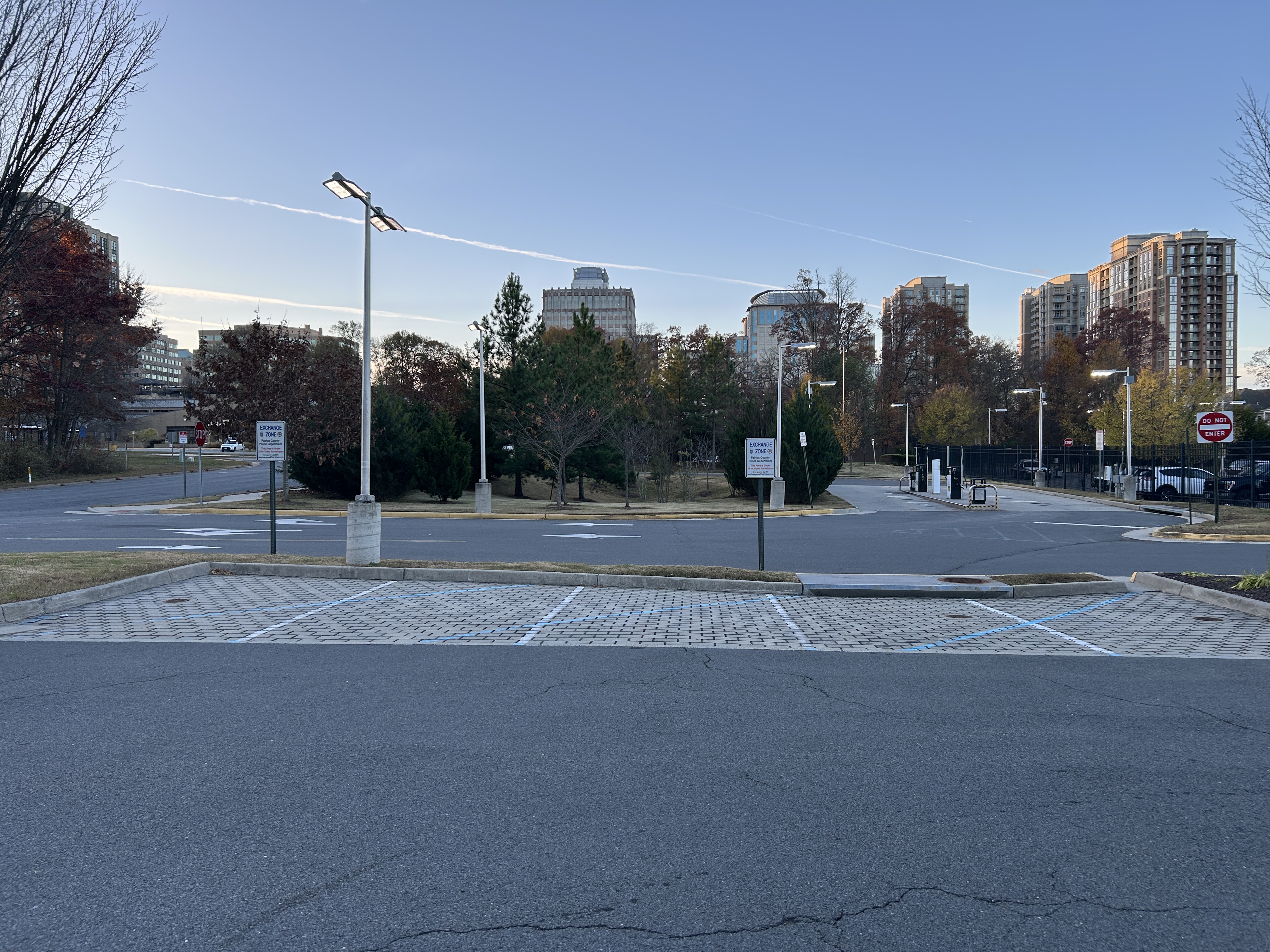 Marked Safe Exchange Zone parking spaces in front of a district police station