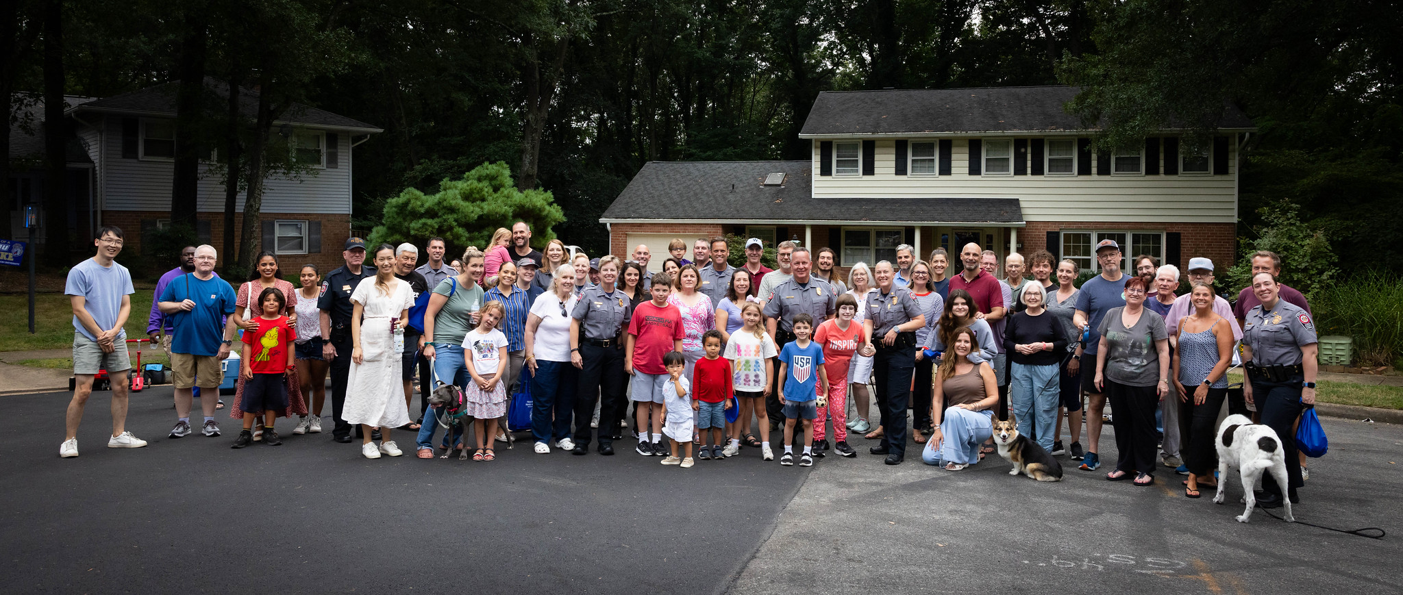 group photo of neighbourhood and community members during a national night out event