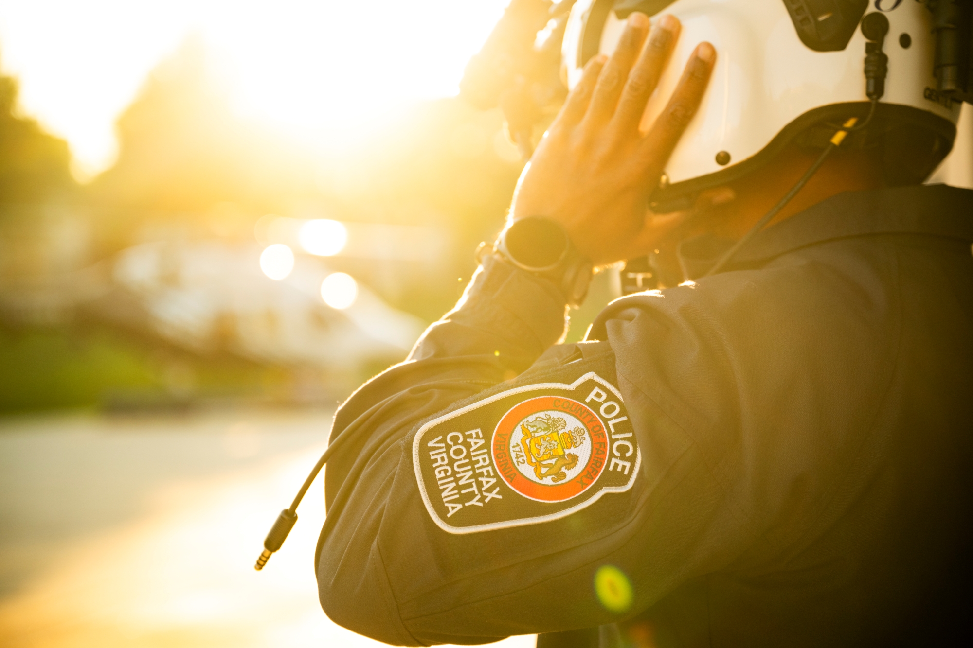 side view of officer with helmet, showing police patch