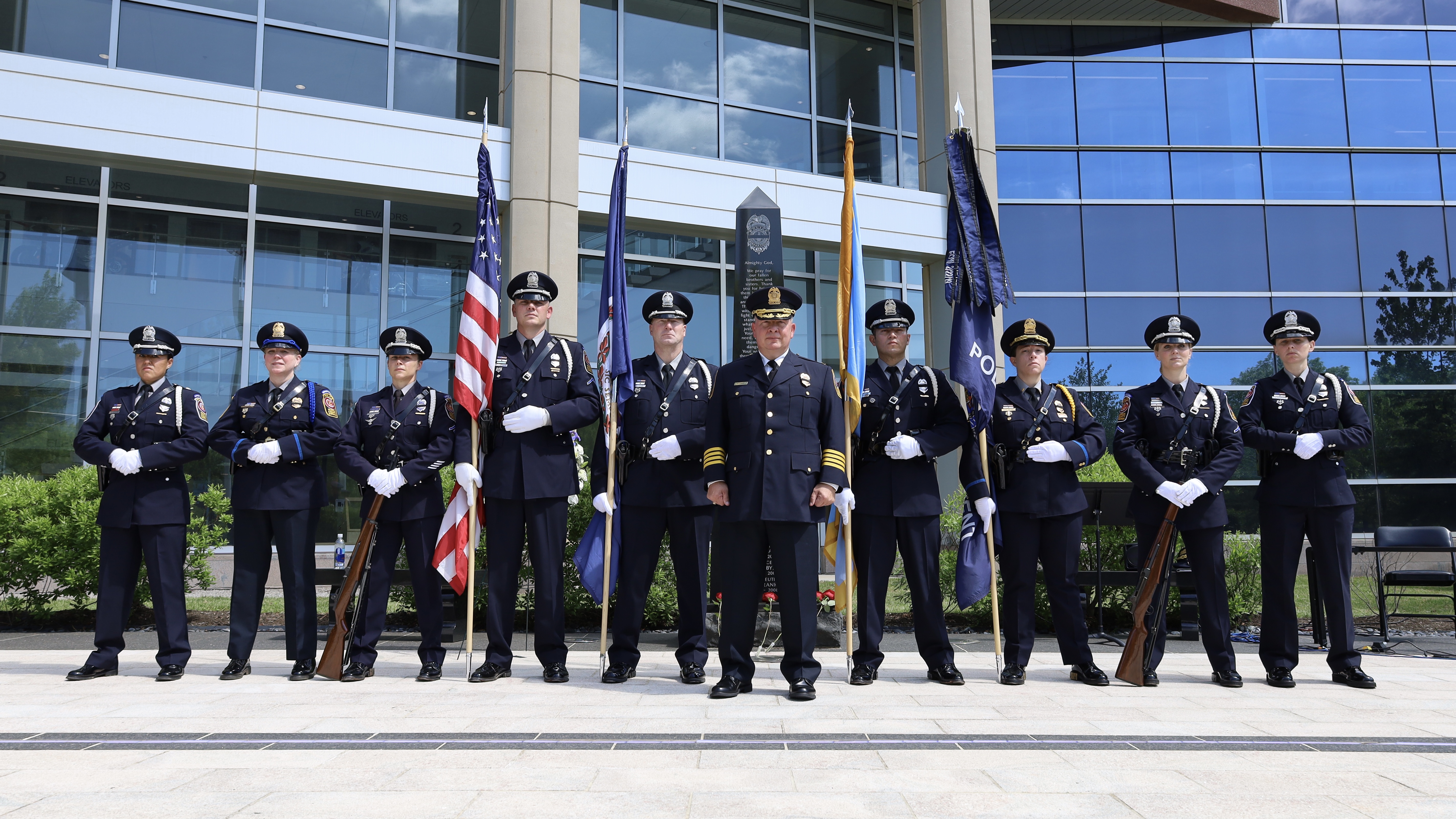 Honor Guard standing with the fallen officers memorial