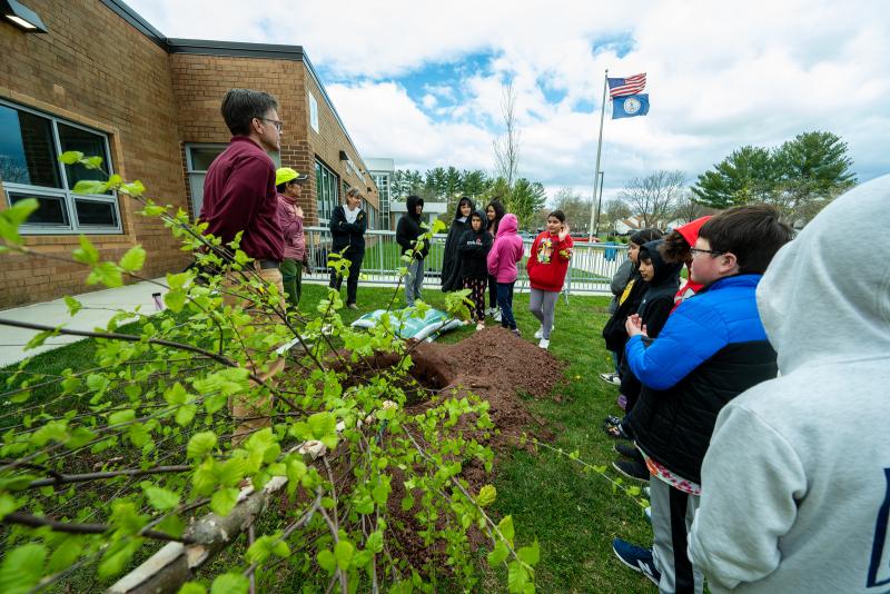 students planting trees for Arbor Day