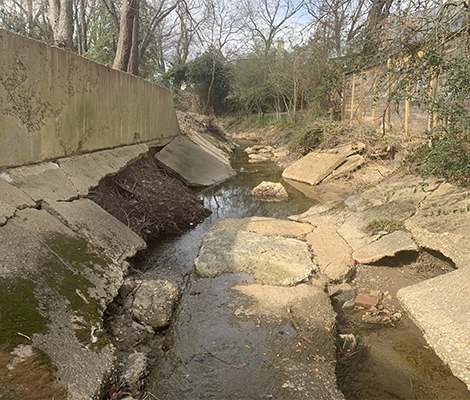 Photo: Deteriorated existing concrete channel