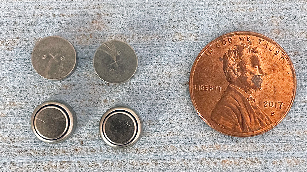 Assortment of carbon zinc button-type batteries.