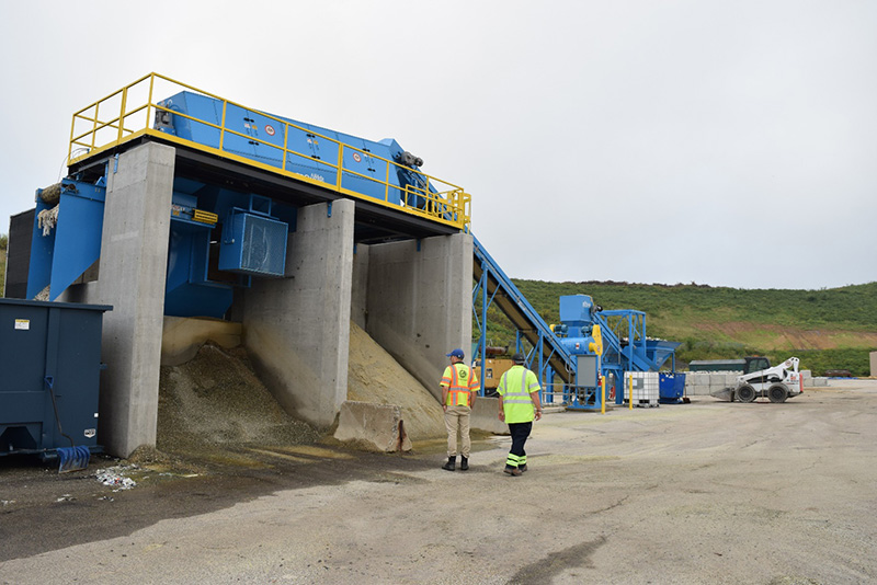 The glass-crushing machine can process 20 tons per hour, creating fine and coarse grades of construction material.