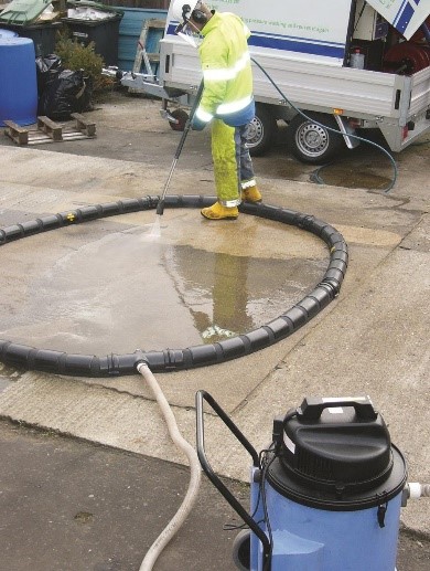 Photo - Using Booms and vacuum System to Capture Wash Water