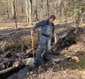 County staff monitoring stream benthic macroinvertebrates.