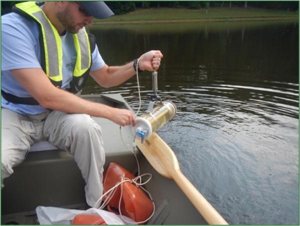 County staff collecting a deep-water sample.
