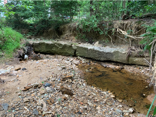 Eroded channel and exposed sewer line at Trapp Rd outfall, Annandale, VA.