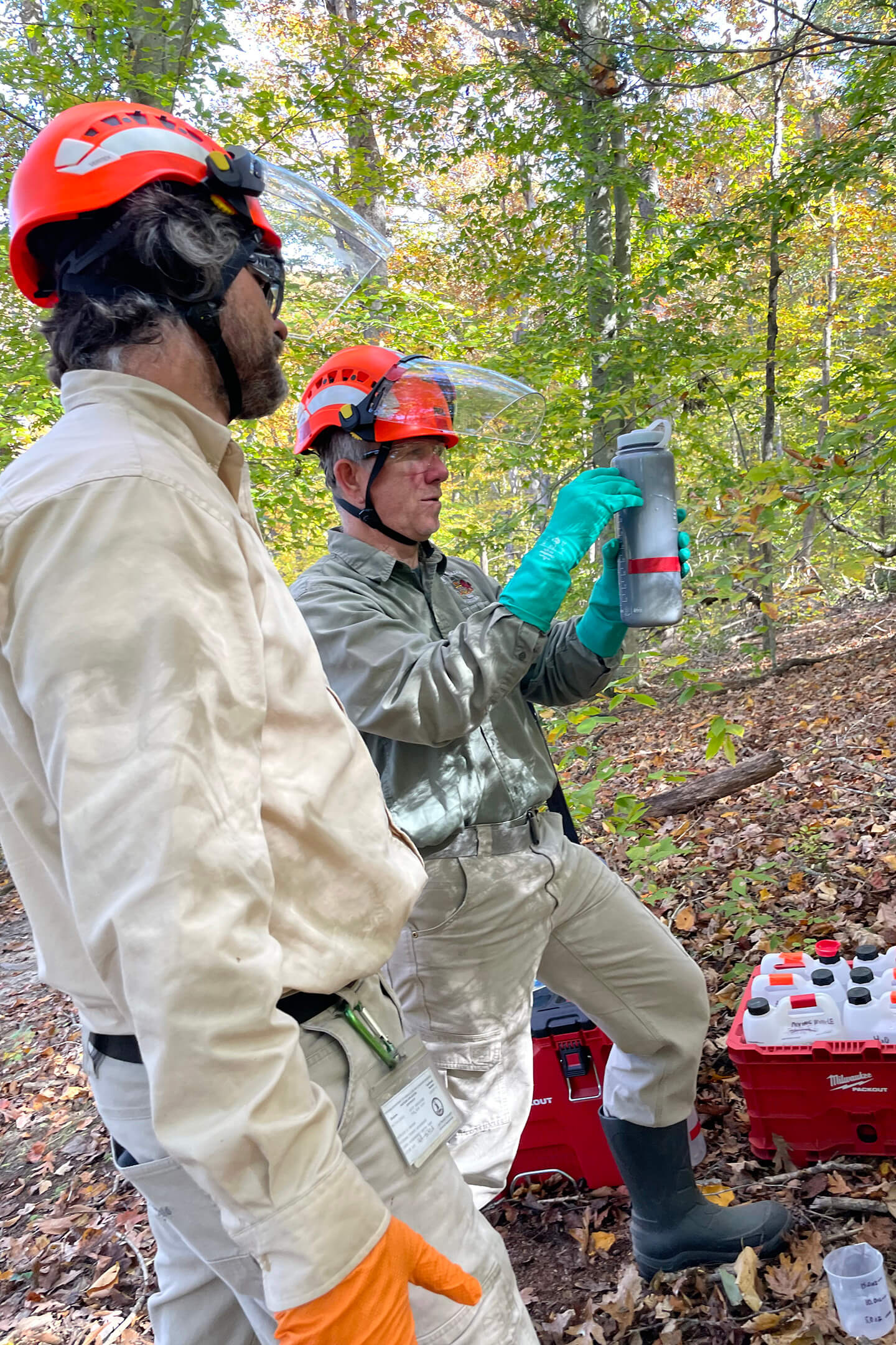 Urban Foresters measuring pesticide for soil drench application.