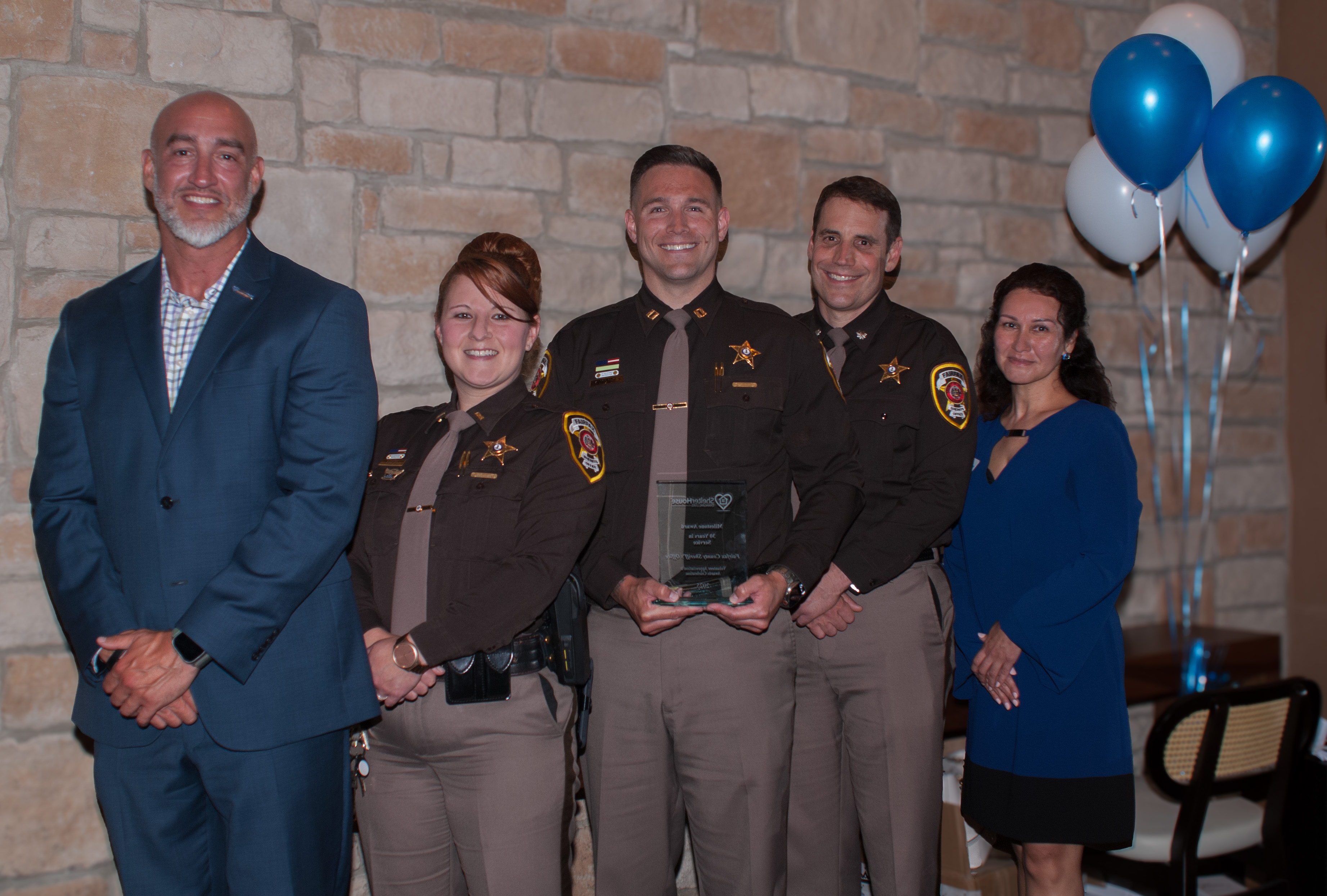 Fairfax County Sheriff Deputies accept the agency's 30-Year Milestone Award 