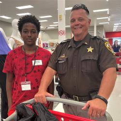 Deputy and young man shop for clothing at Target