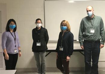 Four teachers wearing masks