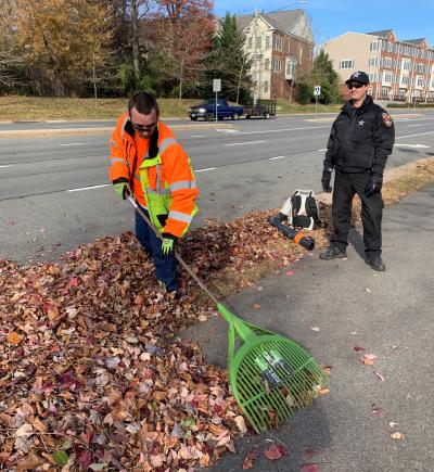 Deputy Ulsh and Aaron, who is raking leaves