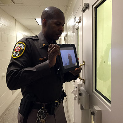 Deputy demonstrates use of iPad for telepsychiatry