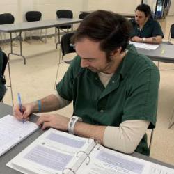 Matt takes notes during peer recovery specialist class