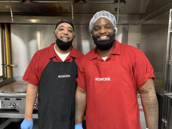 Two inmates in the Adult Detention Center kitchen