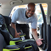 deputy installing child safety seat