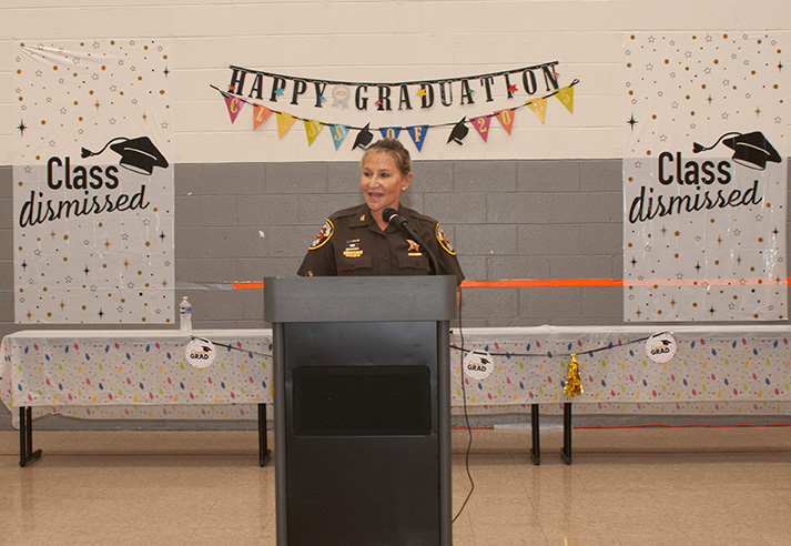 Sheriff Stacey Kincaid speaks to the graduates in the Adult Detention Center June 12. 
