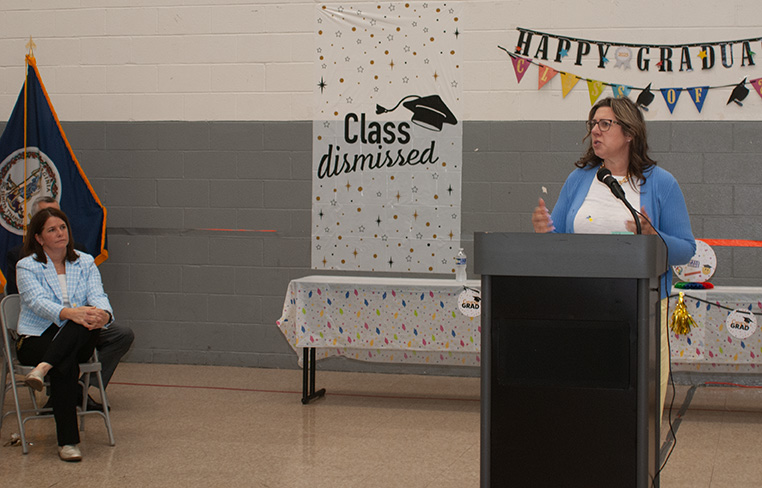Assistant Superintendent of the Department of School Improvement and Supports Marie Lemmon congratulates the student inmates on their achievement.