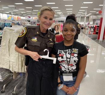Sheriff Stacey Kincaid and young girl shop at Target