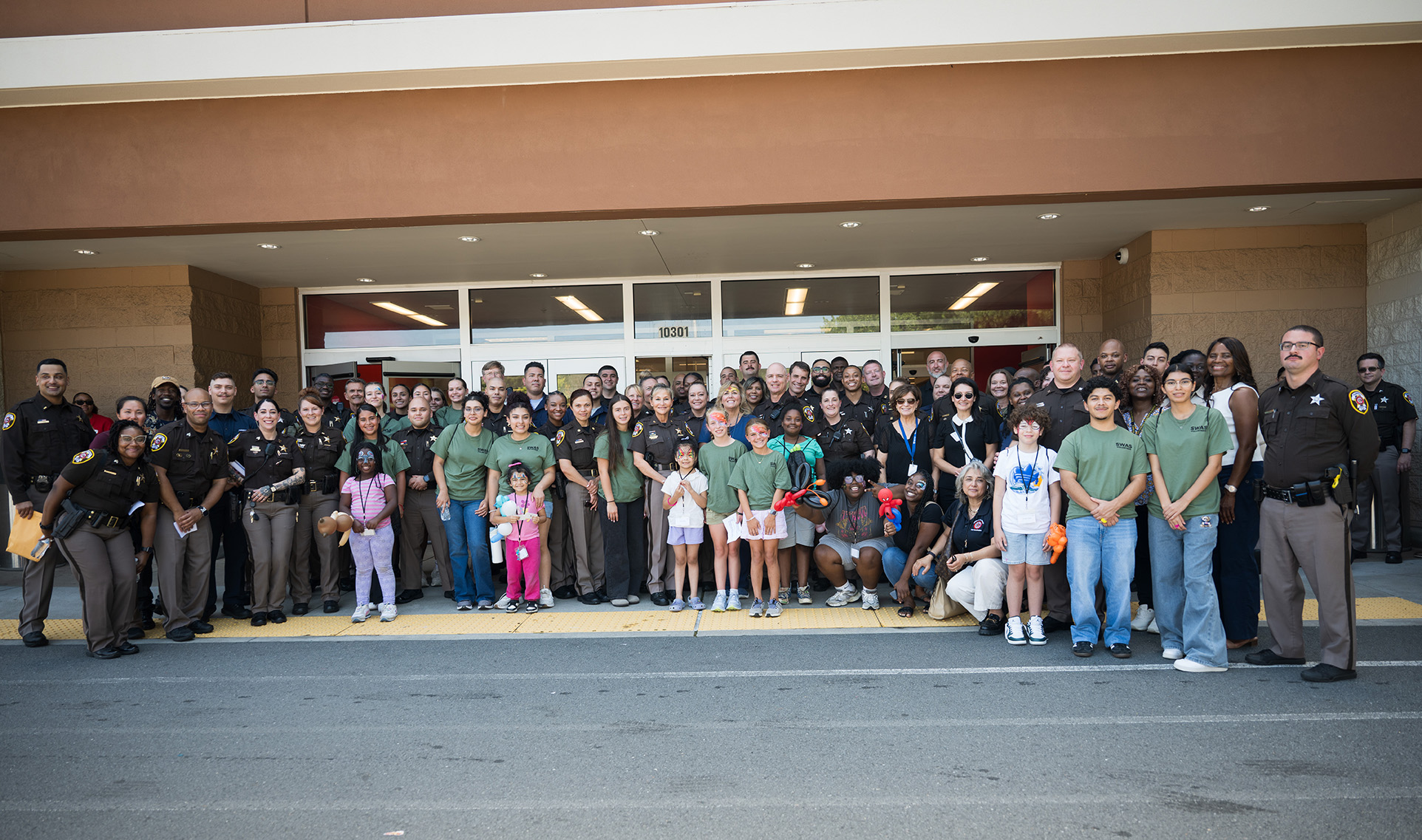 Fairfax County Sheriff Stacey Kincaid and Shelter House, Inc., take newly 40 shelter children back-to-school shopping at Target in Burkey, Va., Aug. 12, 2025. 