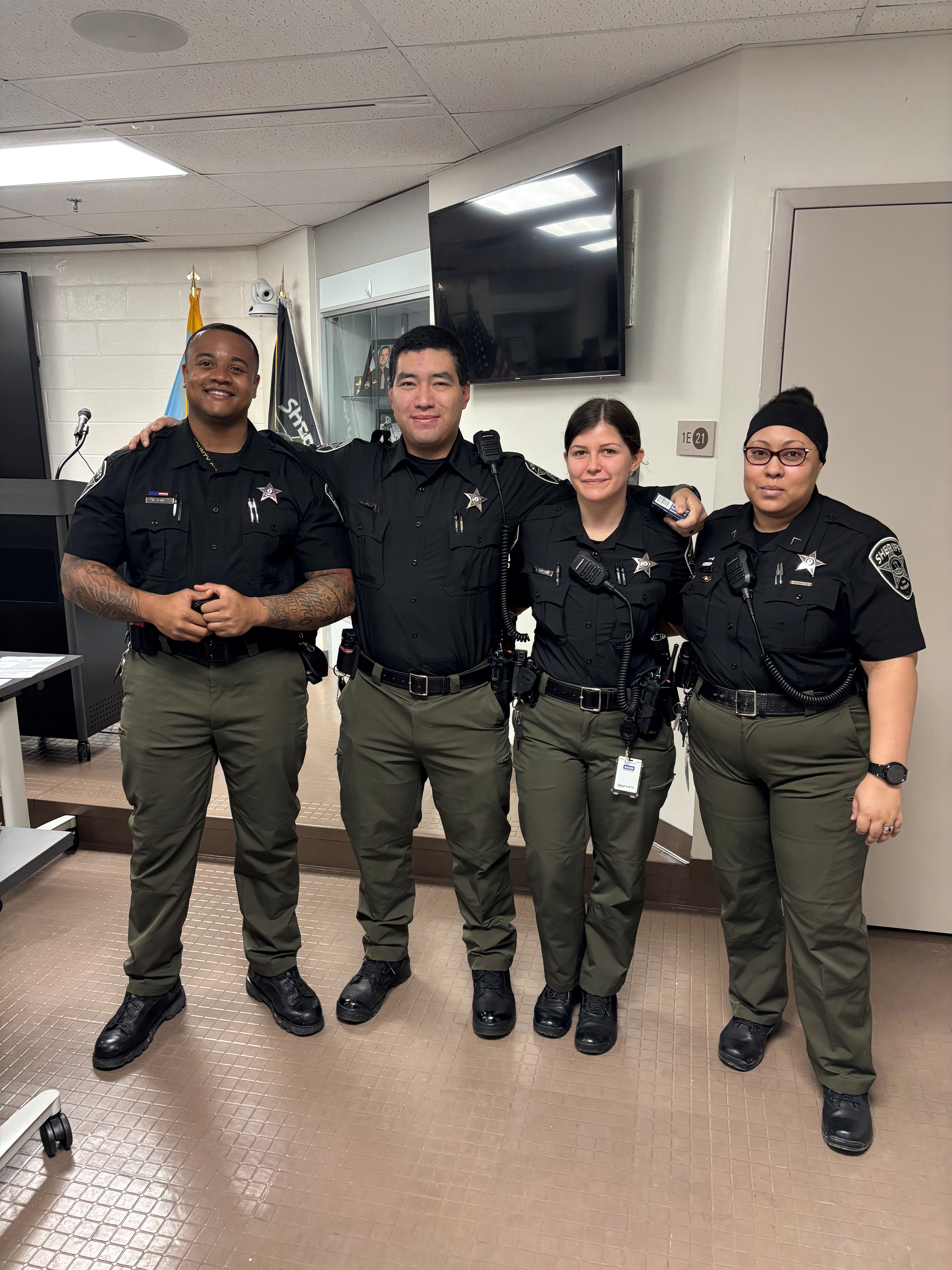Deputy Don Jones, Deputy Joaquin Cortez, Deputy Amanda Preston, PFC Savannah Barden (FTI) PFC Barden gave them their personalized handcuffs during roll call.
