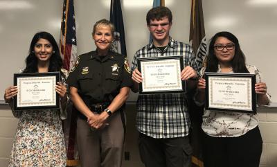 Sheriff Kincaid and three scholarship winners
