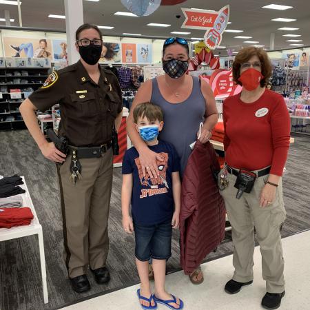 Captain Jaime Popik with Connor, his mom and Target employee