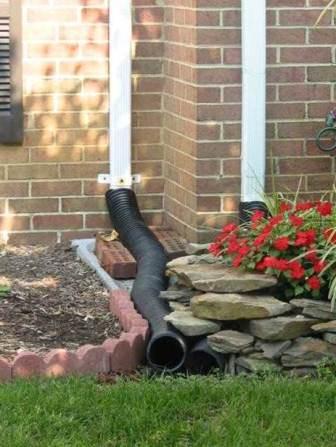 Downspout extensions direct water away from the foundation of the house