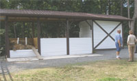 Compost structure with roof and concrete floor