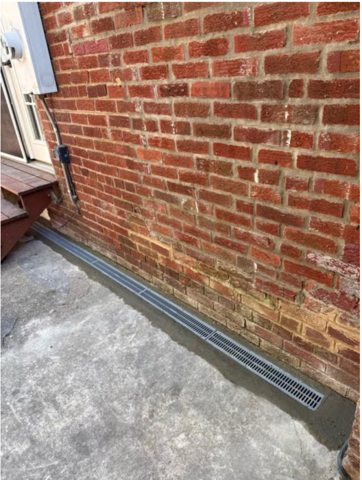 trench drain in concrete near foundation