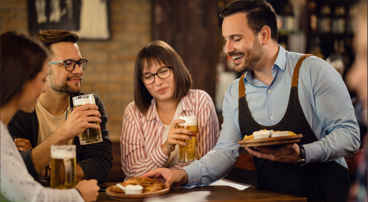 Image of Restaurant Customers Being Served Food